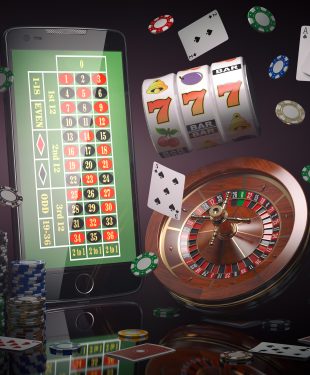 Online casino concept. Mobile phone, roulette with casino chips,